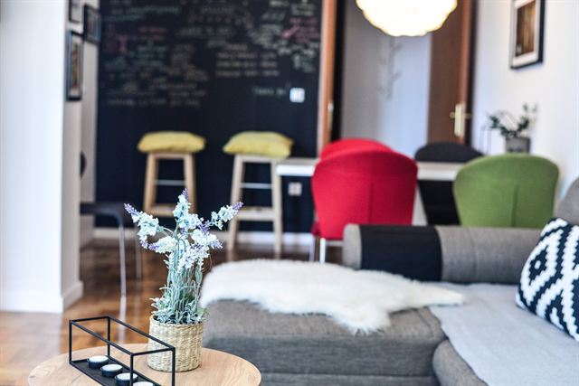 Living area with chalkboard wall and dining corner