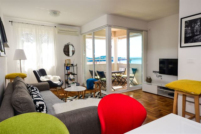 Living room opening onto the sea-view balcony